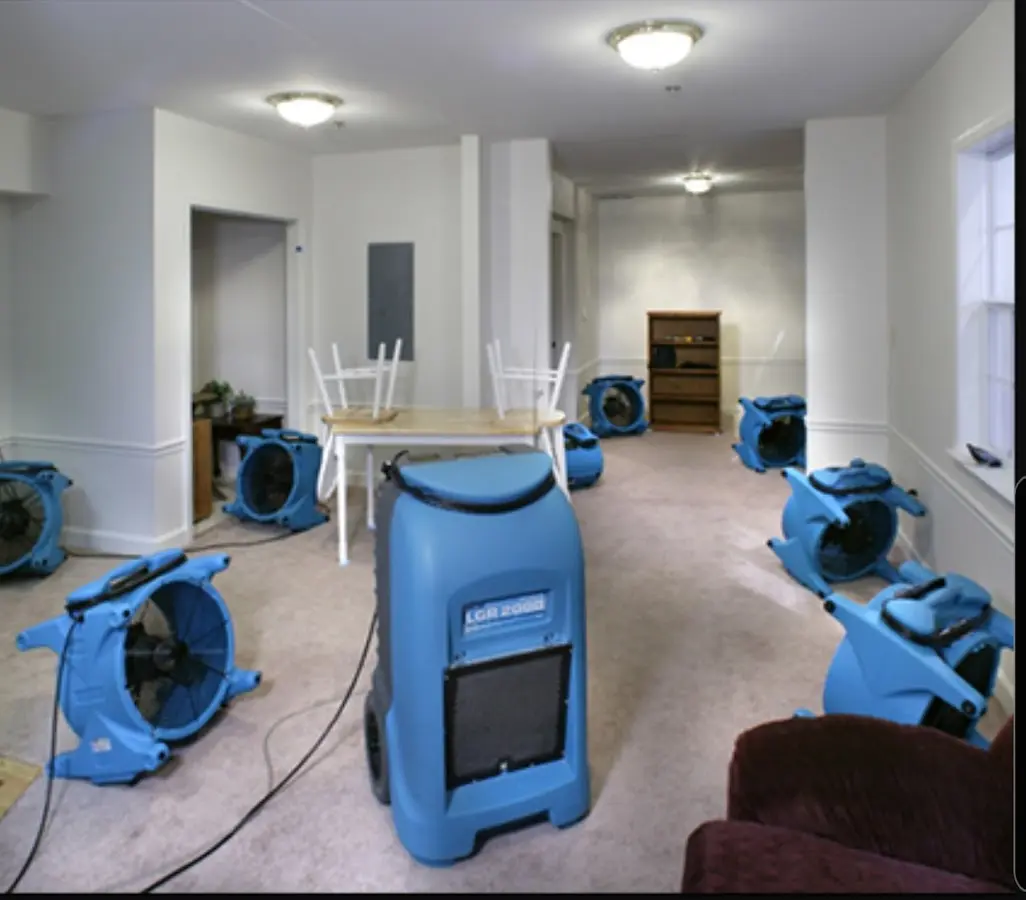Air movers and dehumidifier setup for Water Damage Restoration in Kaser